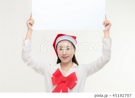 Christmas Day. Korea woman holding a white card 45192707
