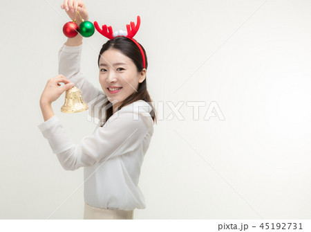 Christmas Day. Korea woman holding xmas props Christmas Day. Korea woman holding xmas props 45192731