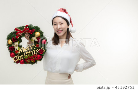 Christmas Day. Korea woman holding xmas props Christmas Day. Korea woman holding xmas props 45192753