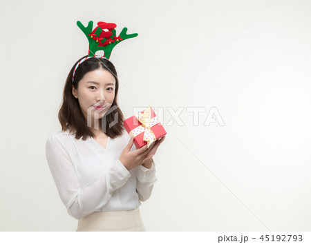 Christmas Day. Korea woman holding xmas props Christmas Day. Korea woman holding xmas props 45192793