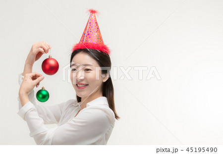 Christmas Day. Korea woman holding xmas props Christmas Day. Korea woman holding xmas props 45195490