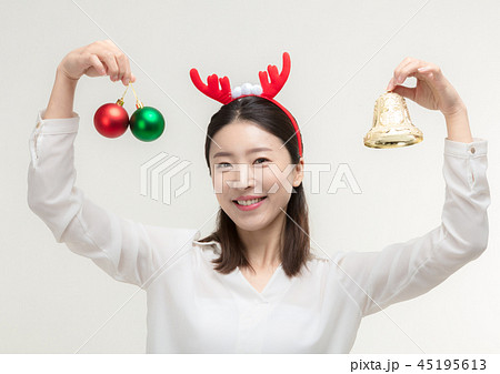 Christmas Day. Korea woman holding xmas props 45195613