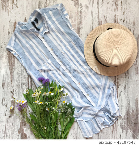Women's striped shirt on a wooden background Women's striped shirt on a wooden background 45197545