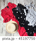 Two dresses polka dot on a wooden background 45197750