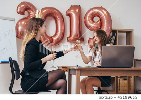 Two business women having party at office Two business women having party at office 45199655