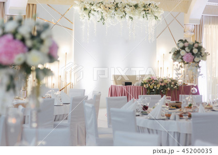 Floral decoration on the wedding table in restaurant Floral decoration on the wedding table in restaurant 45200035