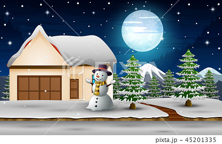 Cute snowman standing next to home in the night 45201335