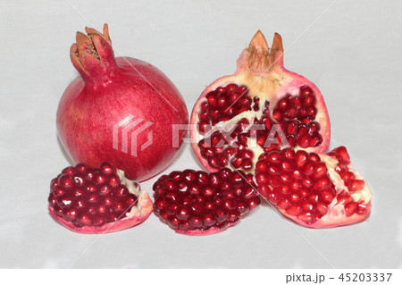 ripe, red pomegranates grown in the garden ripe, red pomegranates grown in the garden 45203337