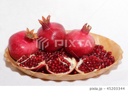 ripe, red pomegranates grown in the garden ripe, red pomegranates grown in the garden 45203344
