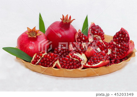 ripe, red pomegranates grown in the garden ripe, red pomegranates grown in the garden 45203349