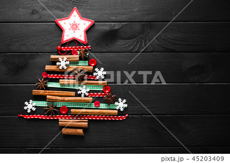Christmas tree made of cinnamon, anise, ribbons and buttons 45203409