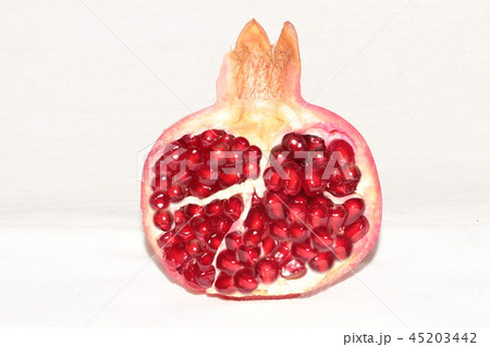 ripe, red pomegranates grown in the garden ripe, red pomegranates grown in the garden 45203442