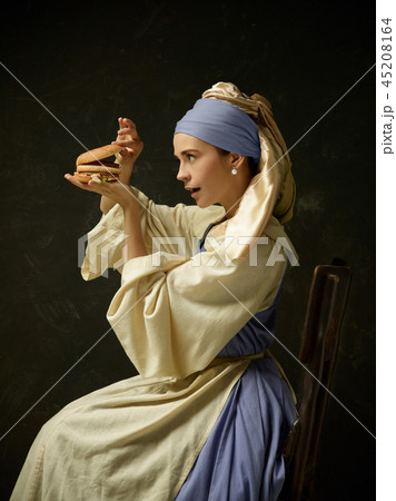 Medieval Woman in Historical Costume Wearing Corset Dress and Bonnet. Medieval Woman in Historical Costume Wearing Corset Dress and Bonnet. 45208164