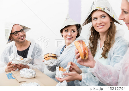 Friends enjoying the fast food at new house 45212794