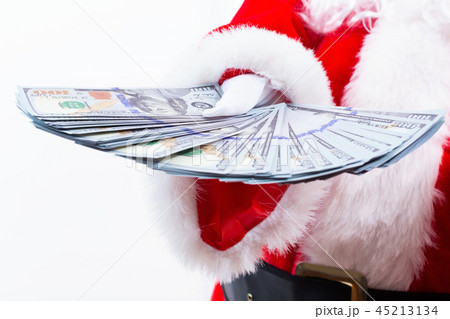 Santa holding US dollar bills 45213134
