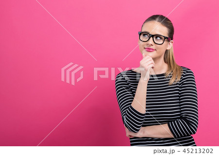 Young woman in a thoughtful pose Young woman in a thoughtful pose 45213202