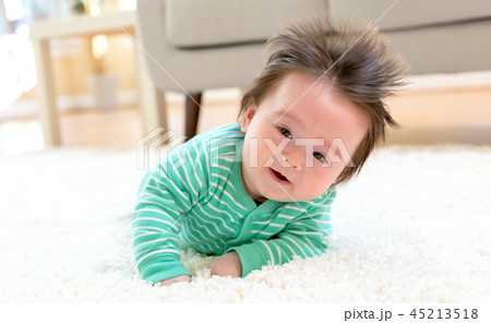 Happy baby boy lying down 45213518