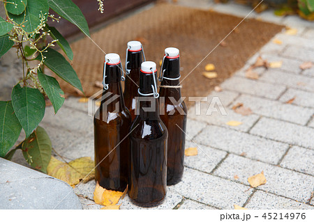 Four empty beer bottles Four empty beer bottles 45214976