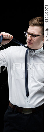Portrait of confident handsome fed up tired elegant responsible businessman on black background 45219075