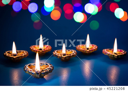 Happy Diwali - Clay Diya lamps lit during Dipavali 45221208