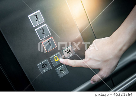 Male hand pressing on emergency button in elevator 45221264