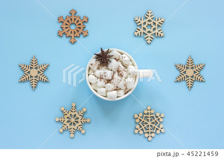 Mug cocoa marshmallows and large wooden snowflakes Mug cocoa marshmallows and large wooden snowflakes 45221459