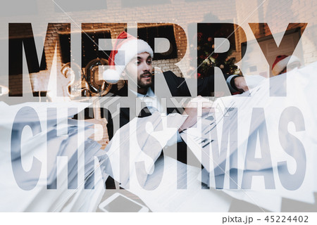 Businessman Works With Documents. Christmas Eve. 45224402