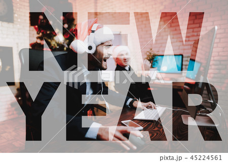 Office Manager Plays Computer On New Year's Eve. 45224561