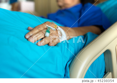Blood test tube on senior woman patient hand in hospital. 45230354