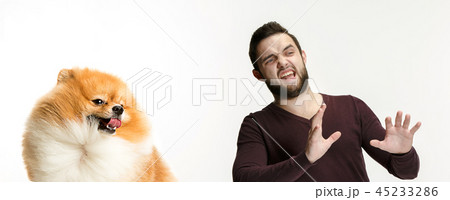 Emotional Portrait of a man and his dog, concept of friendship and care of man and animal Emotional Portrait of a man and his dog, concept of friendship and care of man and animal 45233286