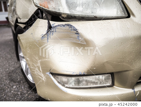 Damaged car after an accident during heavy rain. 45242000