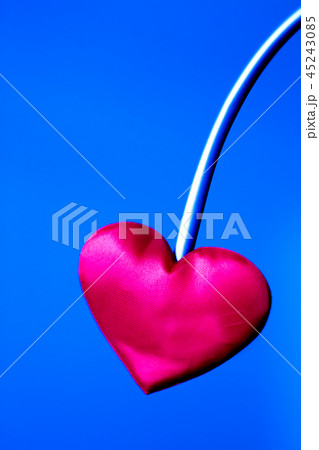 Red heart on neutral background 45243085