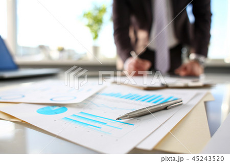 Silver pen lie at important paper on table in office Silver pen lie at important paper on table in office 45243520