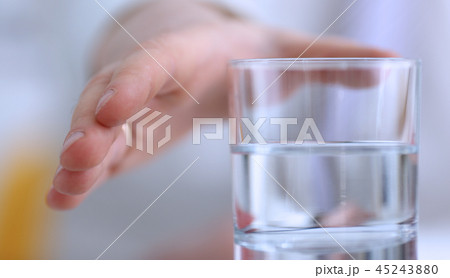 Male arm stretching out to glass 45243880
