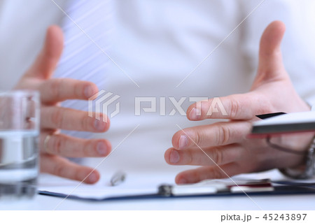 Male arms articulating during conference 45243897