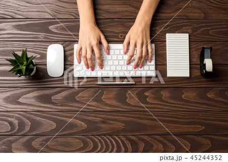 Woman working in office. Top view Woman working in office. Top view 45244352