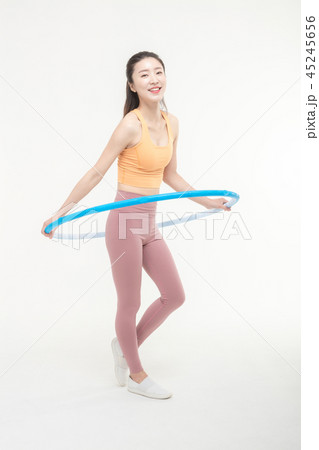 Korean woman exercising hula hoop Korean woman exercising hula hoop 45245656