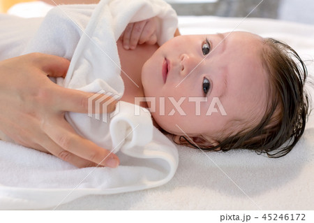 Baby boy taking a bath 45246172