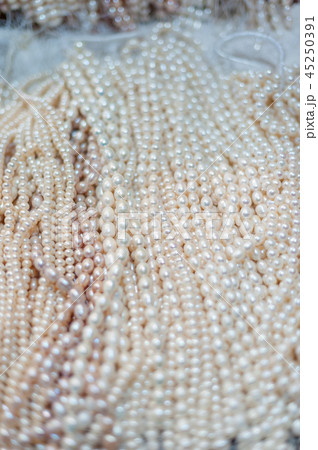 Bunch of pearl necklaces in a street market Bunch of pearl necklaces in a street market 45250391