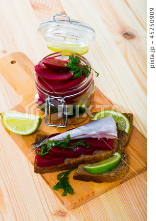 Pickled whiting in homemade marinade with beets Pickled whiting in homemade marinade with beets 45250909