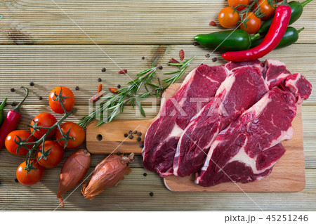 Natural background with raw beef, vegetables Natural background with raw beef, vegetables 45251246