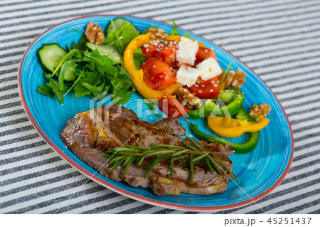 Fried beef loin with summer salad Fried beef loin with summer salad 45251437