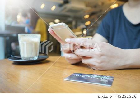 woman hand using smartphone for online shopping woman hand using smartphone for online shopping 45252526