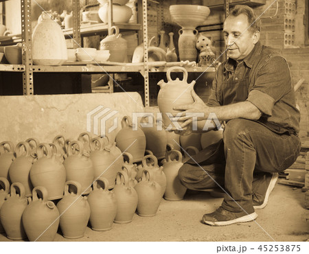 Happy potter at the workshop Happy potter at the workshop 45253875