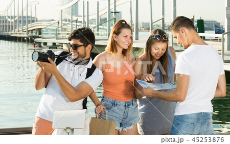 positive tourists looking at the map positive tourists looking at the map 45253876