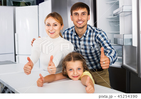 Family choosing refrigerator in store 45254390