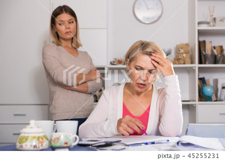 mother and her adult daughter with financial problems mother and her adult daughter with financial problems 45255231