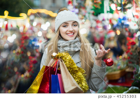 Portrait of happy smiling woman at Christmas fair 45255303