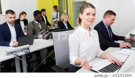 Smiling woman working in office 45255304