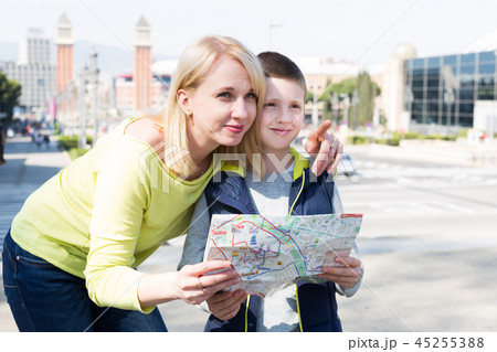 Mother and son reading map guide Mother and son reading map guide 45255388